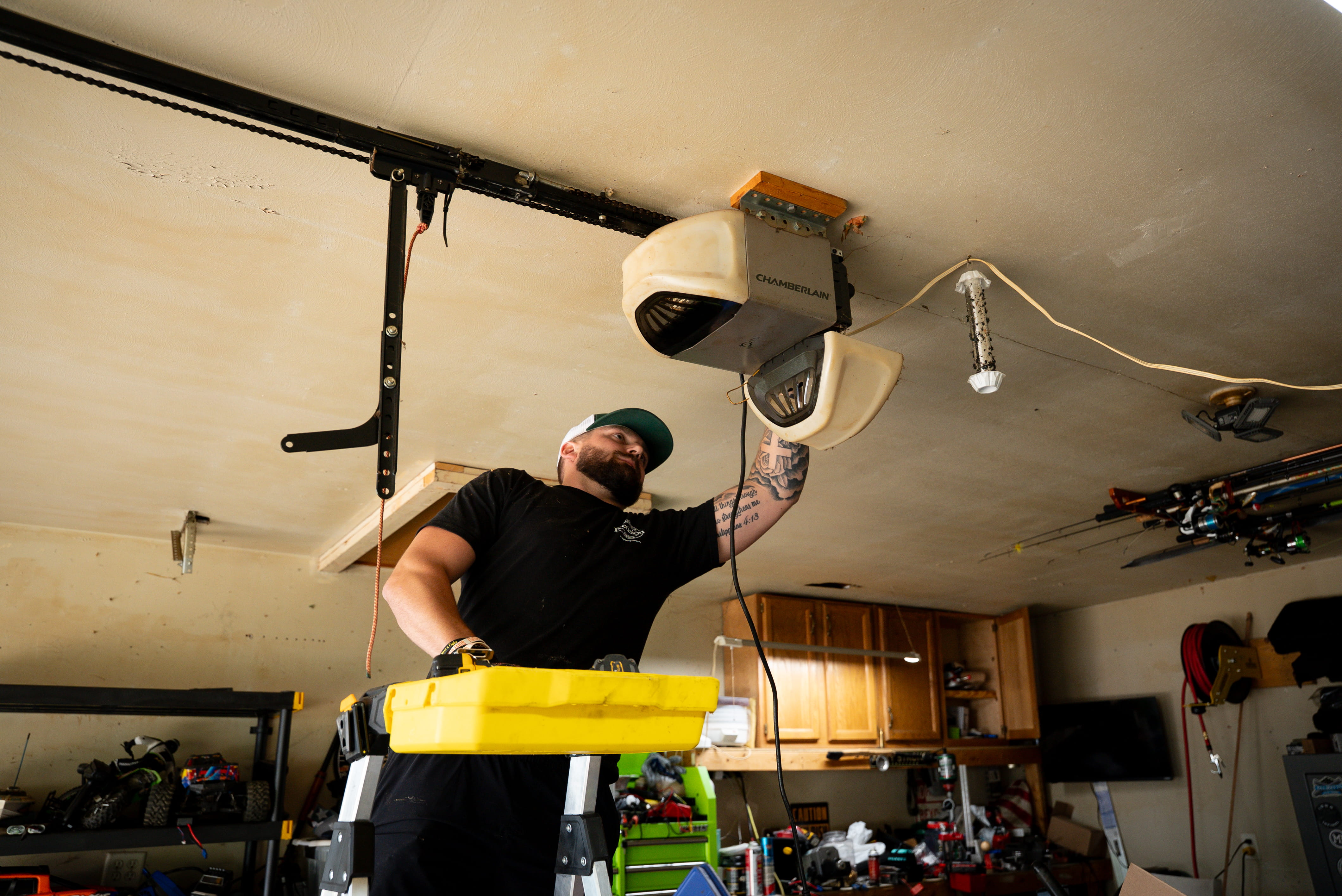 Technician Performing Garage Door Opener Maintenance