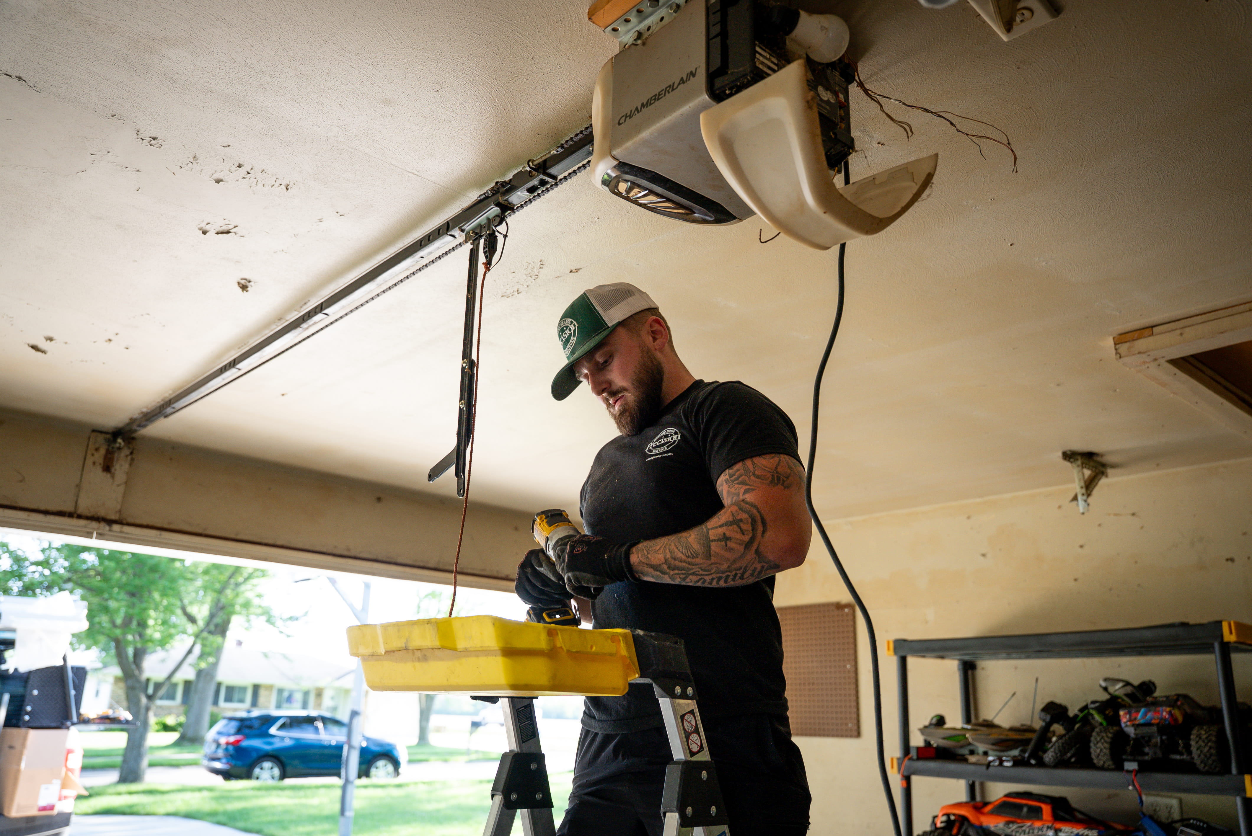 Precision Employee Fixing Garage Door Opener Issue Precision Employee Fixing Garage Door Opener Issue