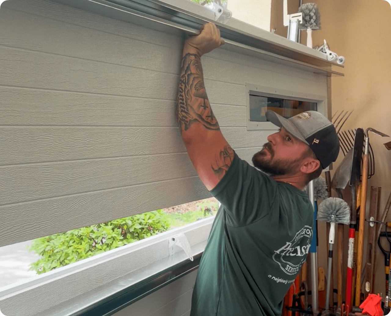 Precision Garage Door Service of Lafayette technician installing new garage door